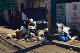 aceras bloqueadas Santo Domingo Oeste parqueos basura